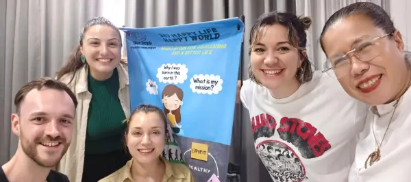 Students with 347 Happy Life Happy World banner